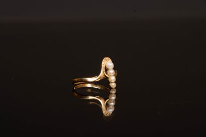 Antique gold ring with a line of small pearls.
Gold...