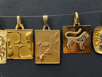 Five gold medals decorated with astrological...