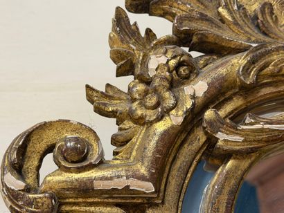 Wood and gilded stucco mirror with parecloses...