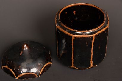 Brown-black enameled stoneware box with cut...