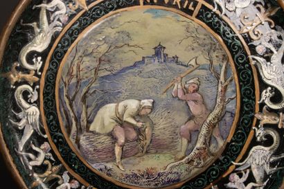 Stoneware dish with enameled decoration of...