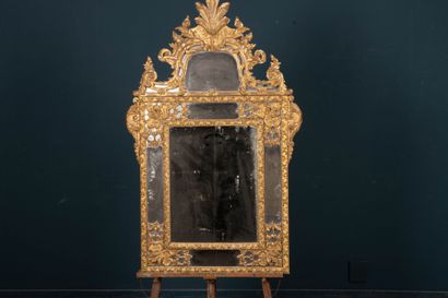 Wood and gilded stucco mirror with parecloses...
