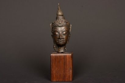 Crowned Buddha head in bronze with brown...