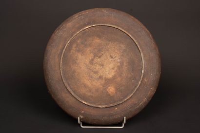 Stoneware dish with enameled decoration of...