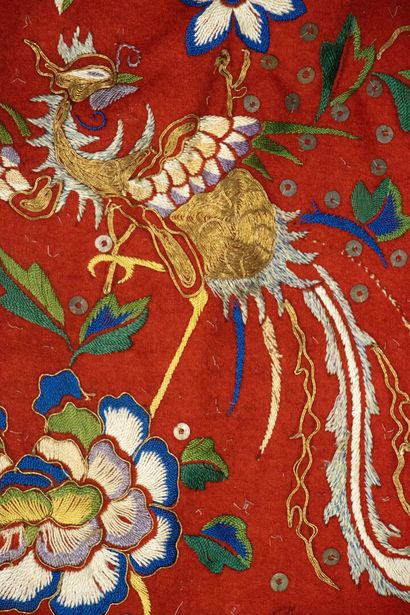 Pair of embroidered red silk curtains.
China...