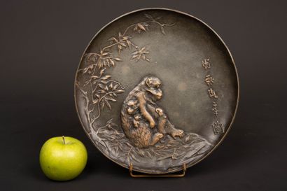 Bronze plate decorated with a monkey and...