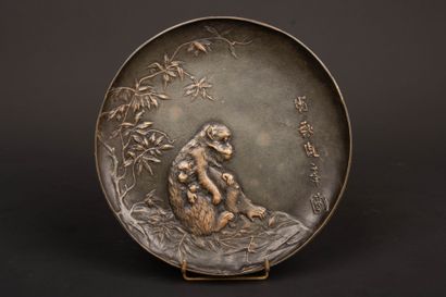 Bronze plate decorated with a monkey and...