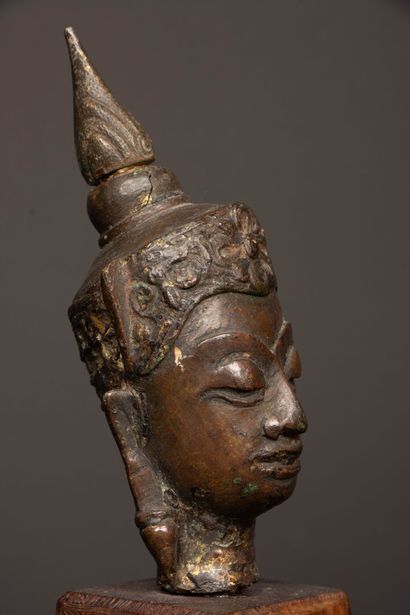 Crowned Buddha head in bronze with brown...