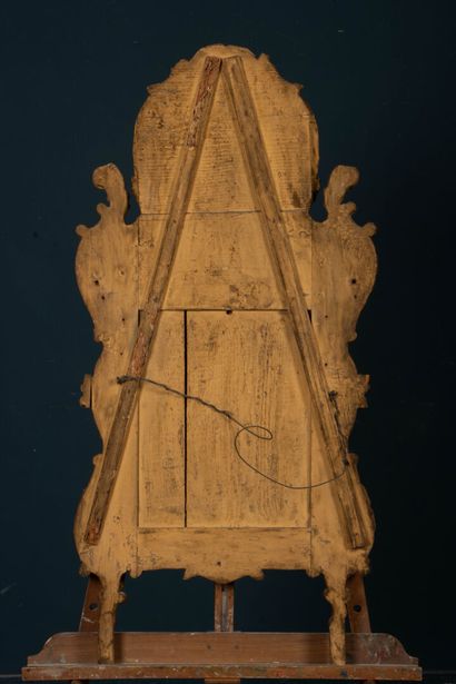 Wood and gilded stucco mirror with a pediment...
