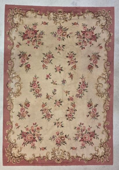 Hand-woven wool rug decorated with flowers...