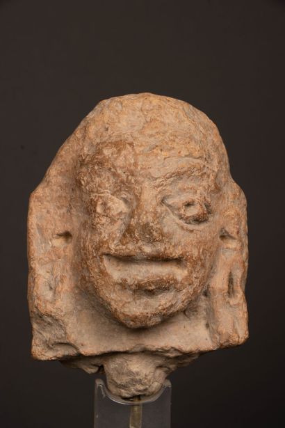INDIA 
Terracotta head, almond-shaped eyes...