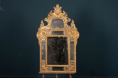 Wood and gilded stucco mirror with parecloses...