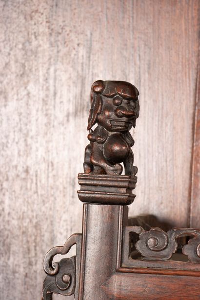 Richly carved exotic wood shelf with two...
