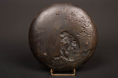 Bronze plate decorated with a monkey and...