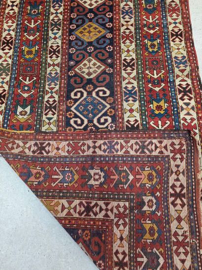 Oriental hand-woven wool rug
Hole at edge...