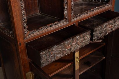 Richly carved exotic wood shelf with two...