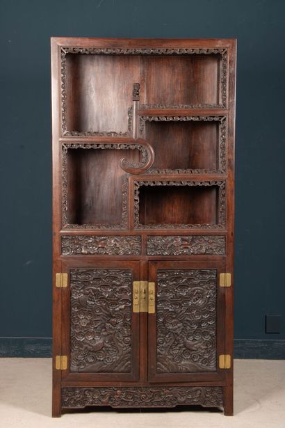 Richly carved exotic wood shelf with two...
