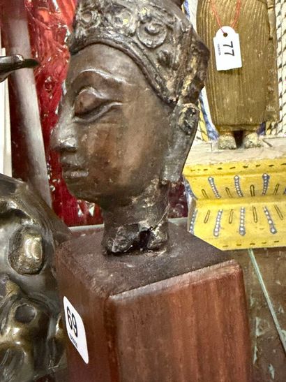 Crowned Buddha head in bronze with brown...