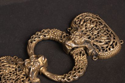 Openwork and chased silver belt buckle decorated...