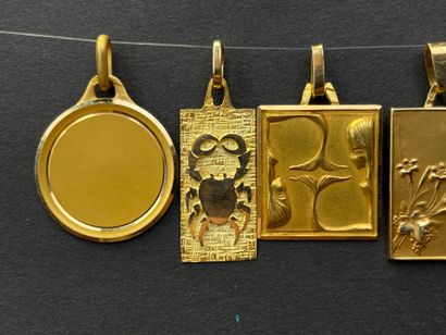 Five gold medals decorated with astrological...