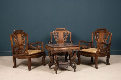 Carved exotic wood salon with three armchairs...