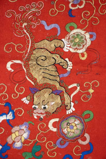 Pair of embroidered red silk curtains.
China...