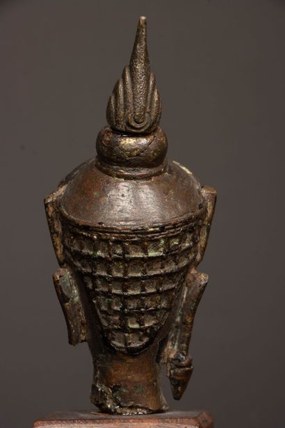 Crowned Buddha head in bronze with brown...