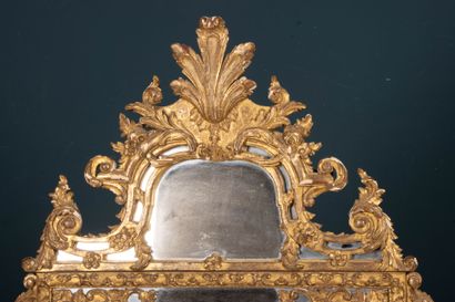 Wood and gilded stucco mirror with parecloses...