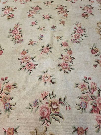 Hand-woven wool rug decorated with flowers...