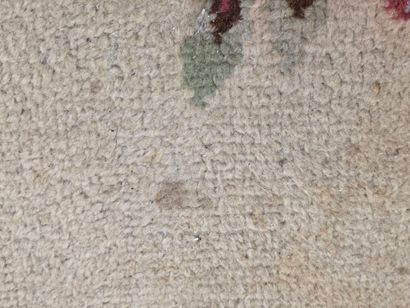 Hand-woven wool rug decorated with flowers...