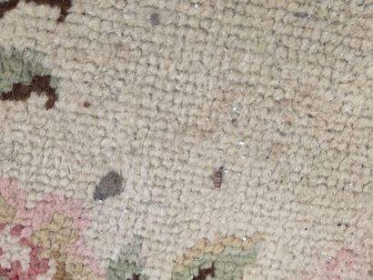 Hand-woven wool rug decorated with flowers...