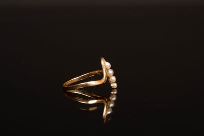 Antique gold ring with a line of small pearls.
Gold...