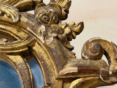 Wood and gilded stucco mirror with parecloses...