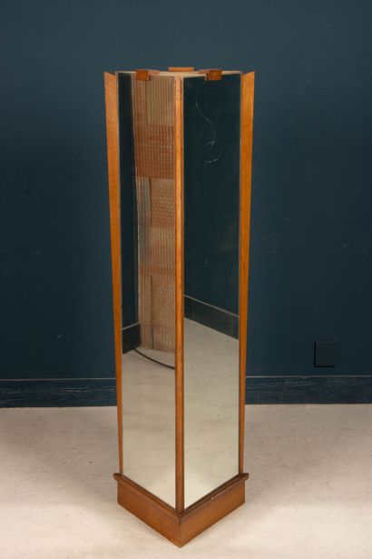 Three-sided boutique column mirror. 
Circa...