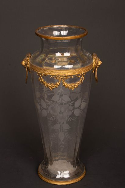 Engraved glass vase with brass frame decorated...
