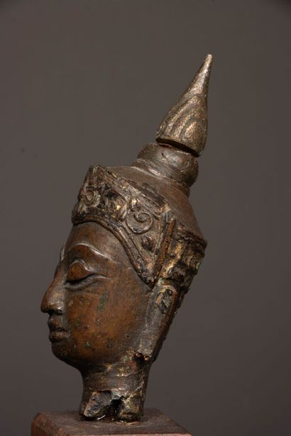 Crowned Buddha head in bronze with brown...