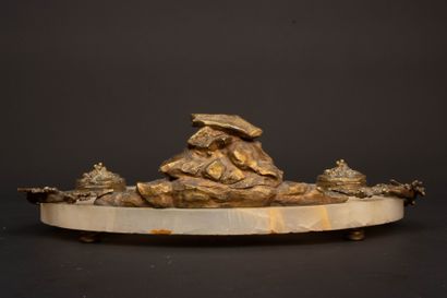 A desk with an alabaster top, bronze sculpture...