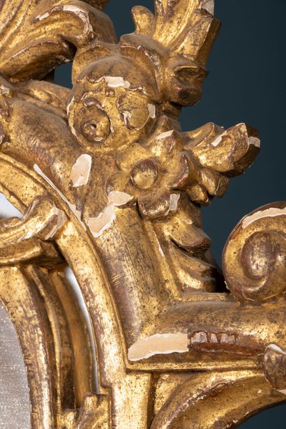 Wood and gilded stucco mirror with parecloses...