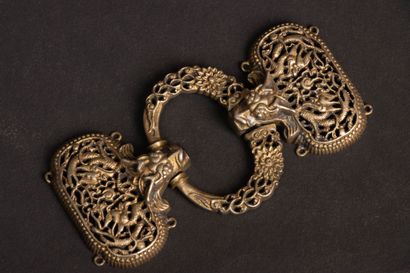 Openwork and chased silver belt buckle decorated...