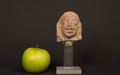 INDIA 
Terracotta head, almond-shaped eyes...