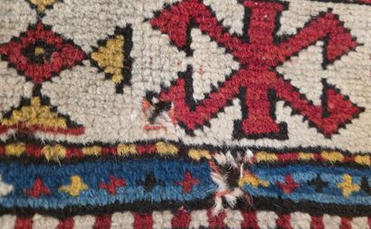 Oriental hand-woven wool rug
Hole at edge...