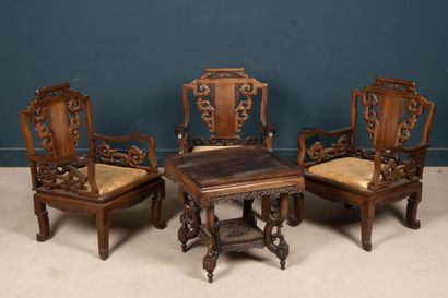 Carved exotic wood salon with three armchairs...