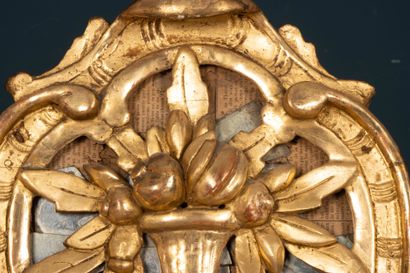Wood and gilded stucco mirror with a pediment...