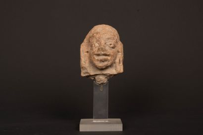 INDIA 
Terracotta head, almond-shaped eyes...