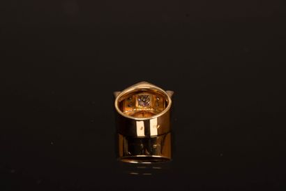 Gold tank ring set with five diamonds, the...