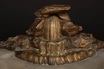 A desk with an alabaster top, bronze sculpture...
