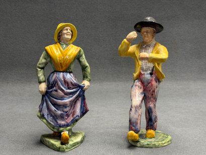 Deux personnages en céramique émaillé. 
H....