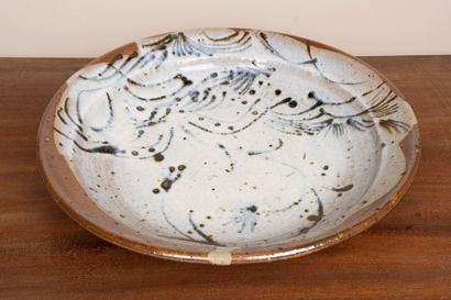 LA BORNE. 
Stoneware dish with enameled interior...