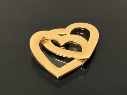Gold pendant featuring two intertwined hearts,
750°/°°...