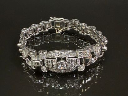Articulated bracelet in platinum and gold...